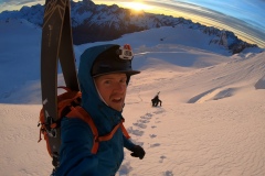 Me boot packing up the East Face, early morning light.