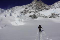 Skinning up to the King Spine under the massive East Face of Cook.